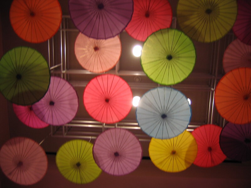 Colorful umbrellas hanging indoors