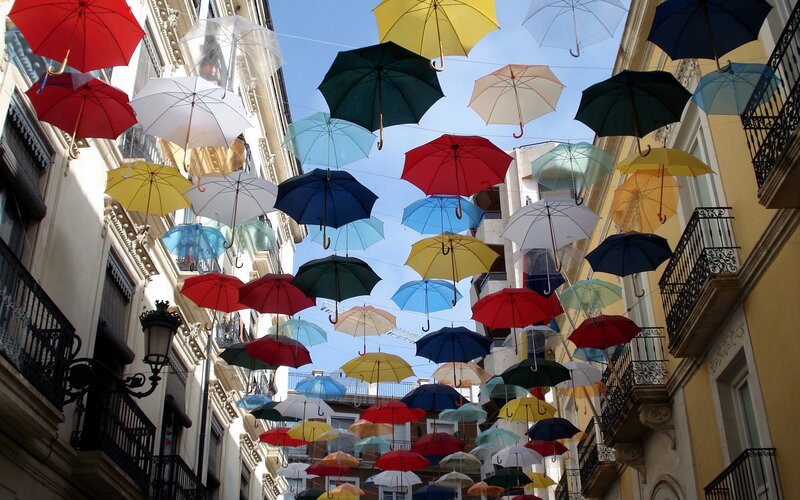 Colorful Umbrellas in Alley — Blue