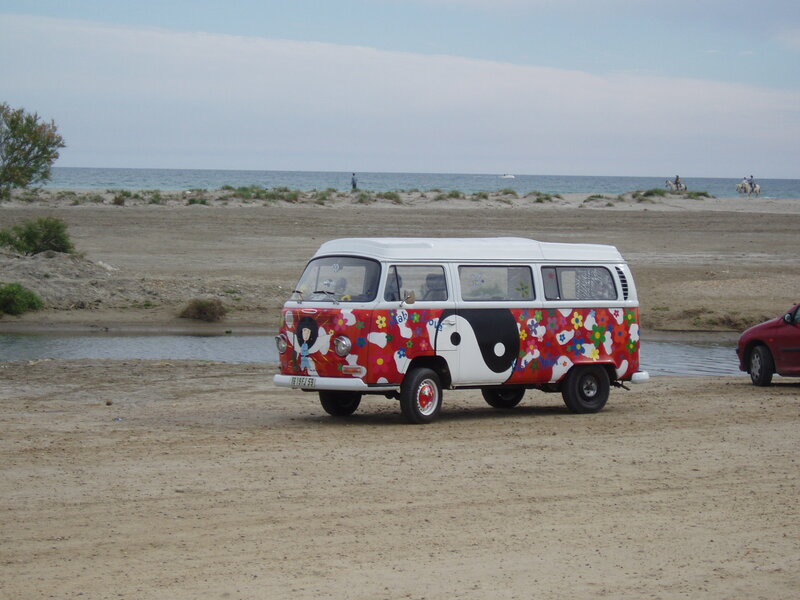 Colorful van on a sandy beach