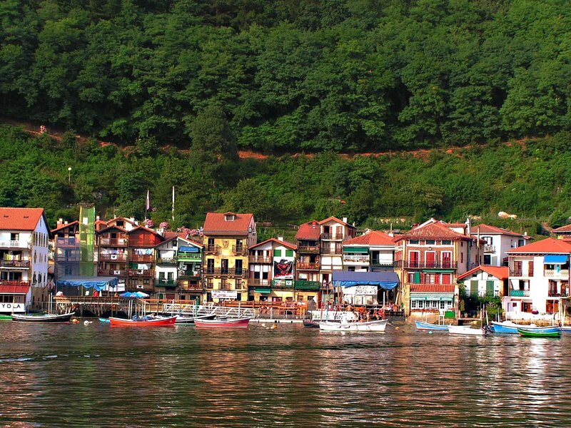 Colorful village on a riverbank