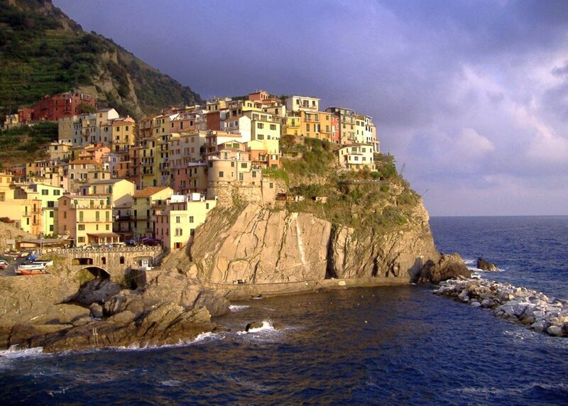 Colorful Village on Cliff — Blue, Dramatic, Afternoon