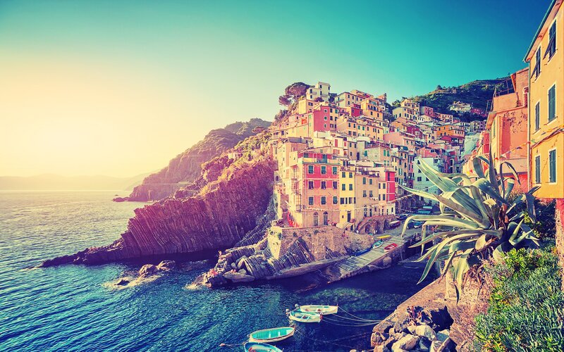 Colorful Village on Cliff — Blue, Serene, Sunset, Photograph, Sea, Boats, Plant