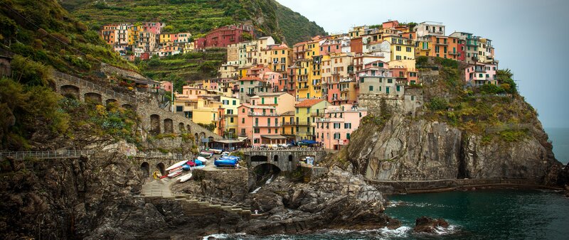 Colorful Village on Cliff — Yellow, Serene