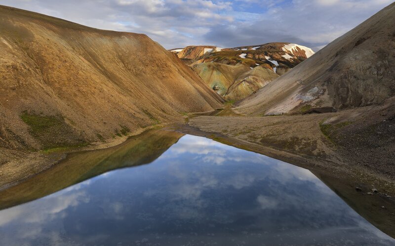 Colorful volcanic landscape with reflection