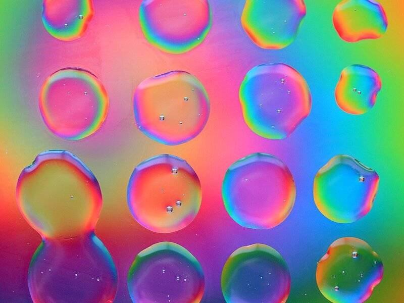 Colorful water droplets on glass