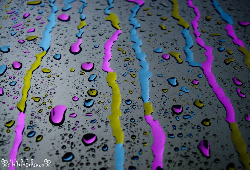 Colorful water droplets on glass