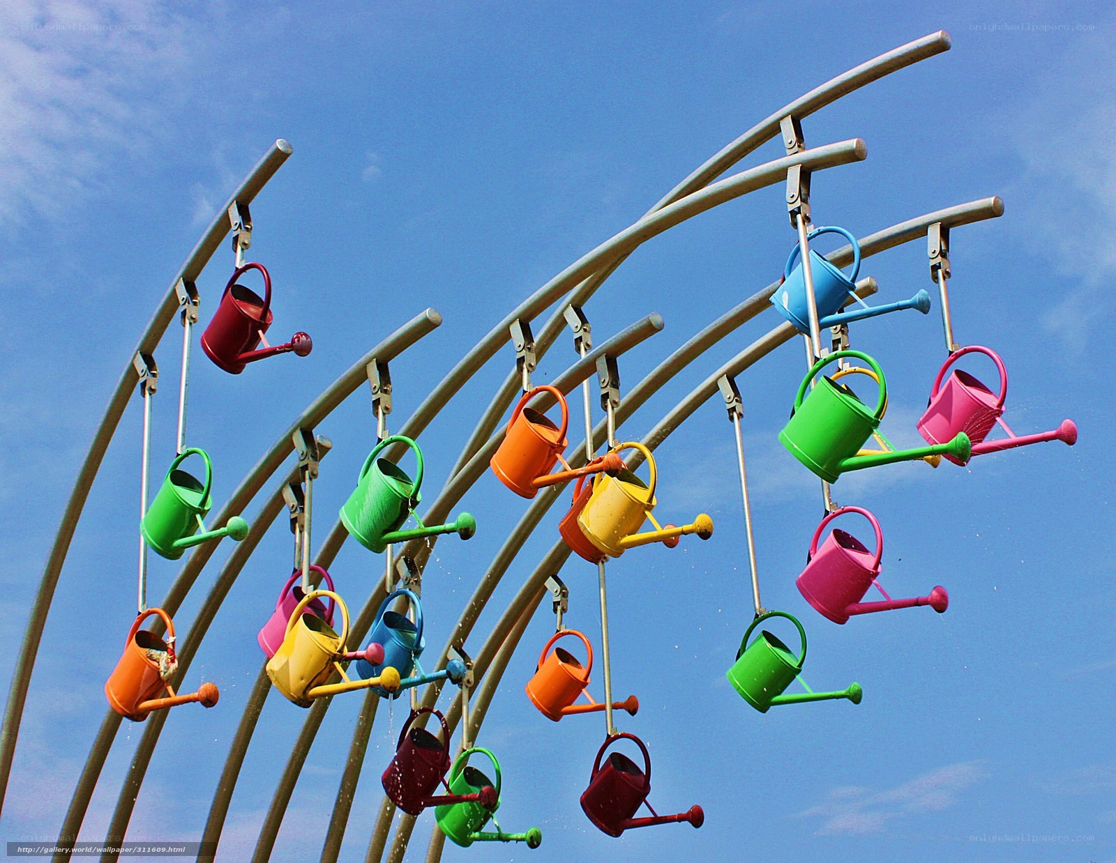 Colorful watering cans sculpture