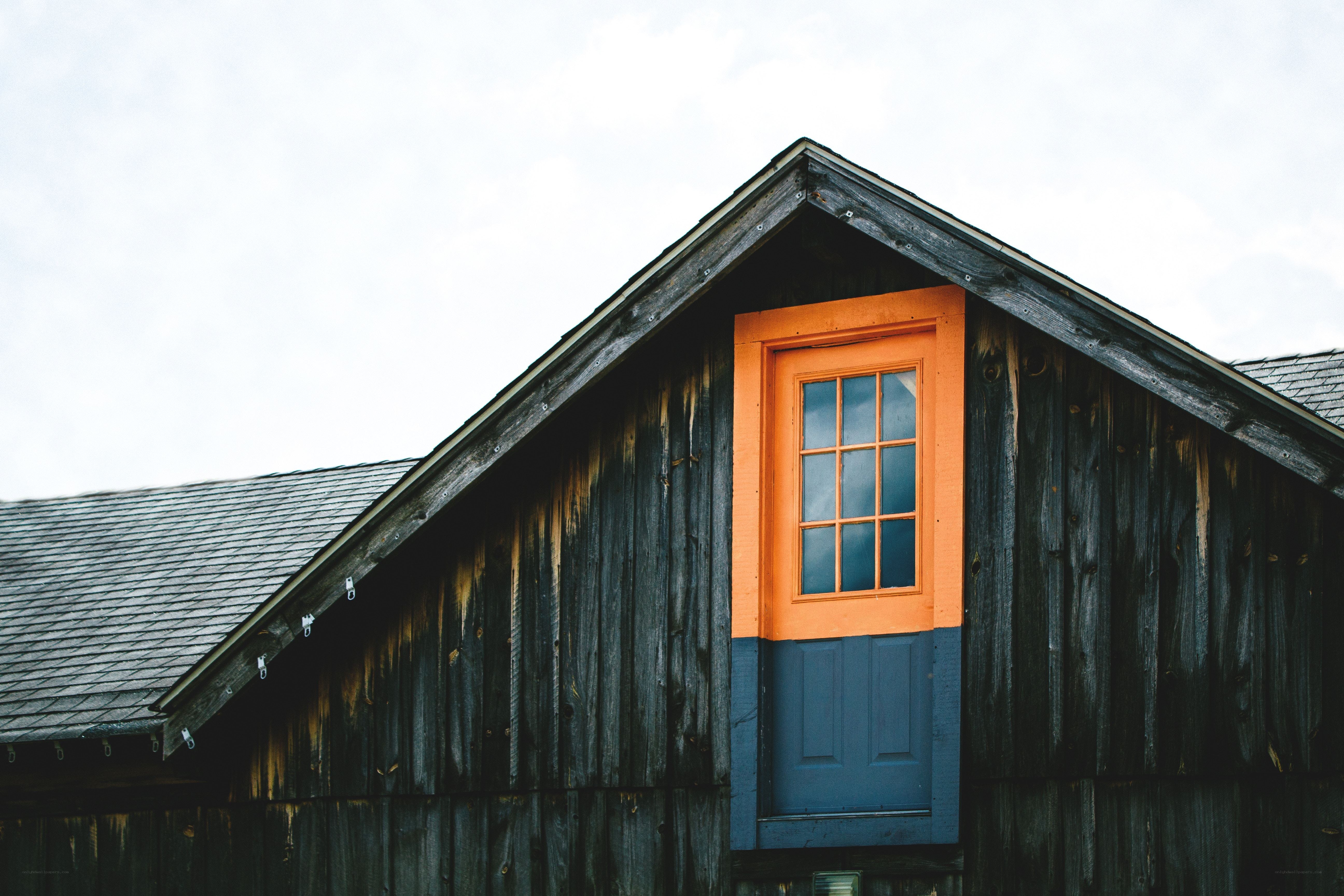 Colorful window on a wooden barn