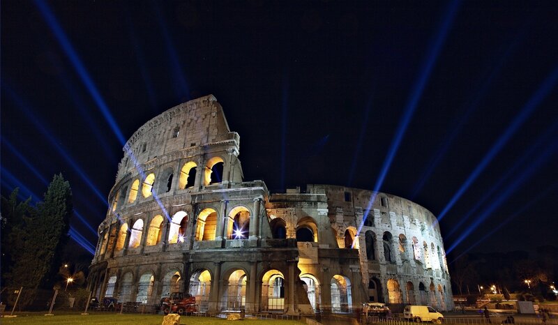 Colosseum at night with laser lights