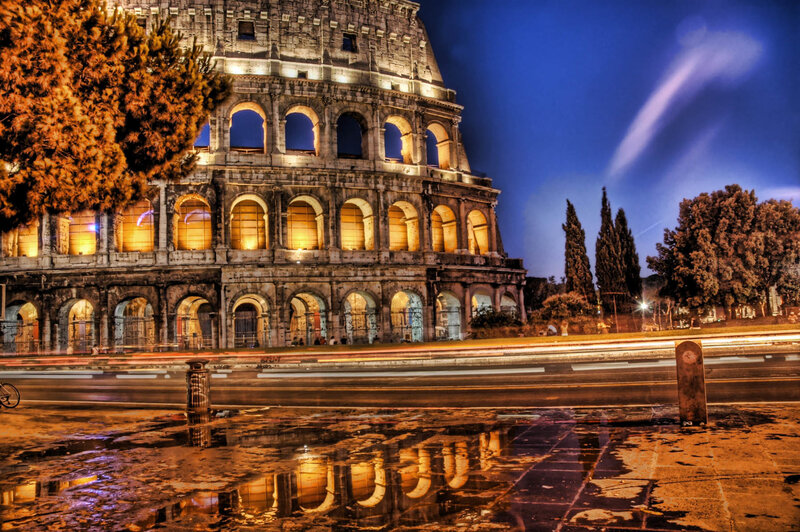Colosseum at night with light trails
