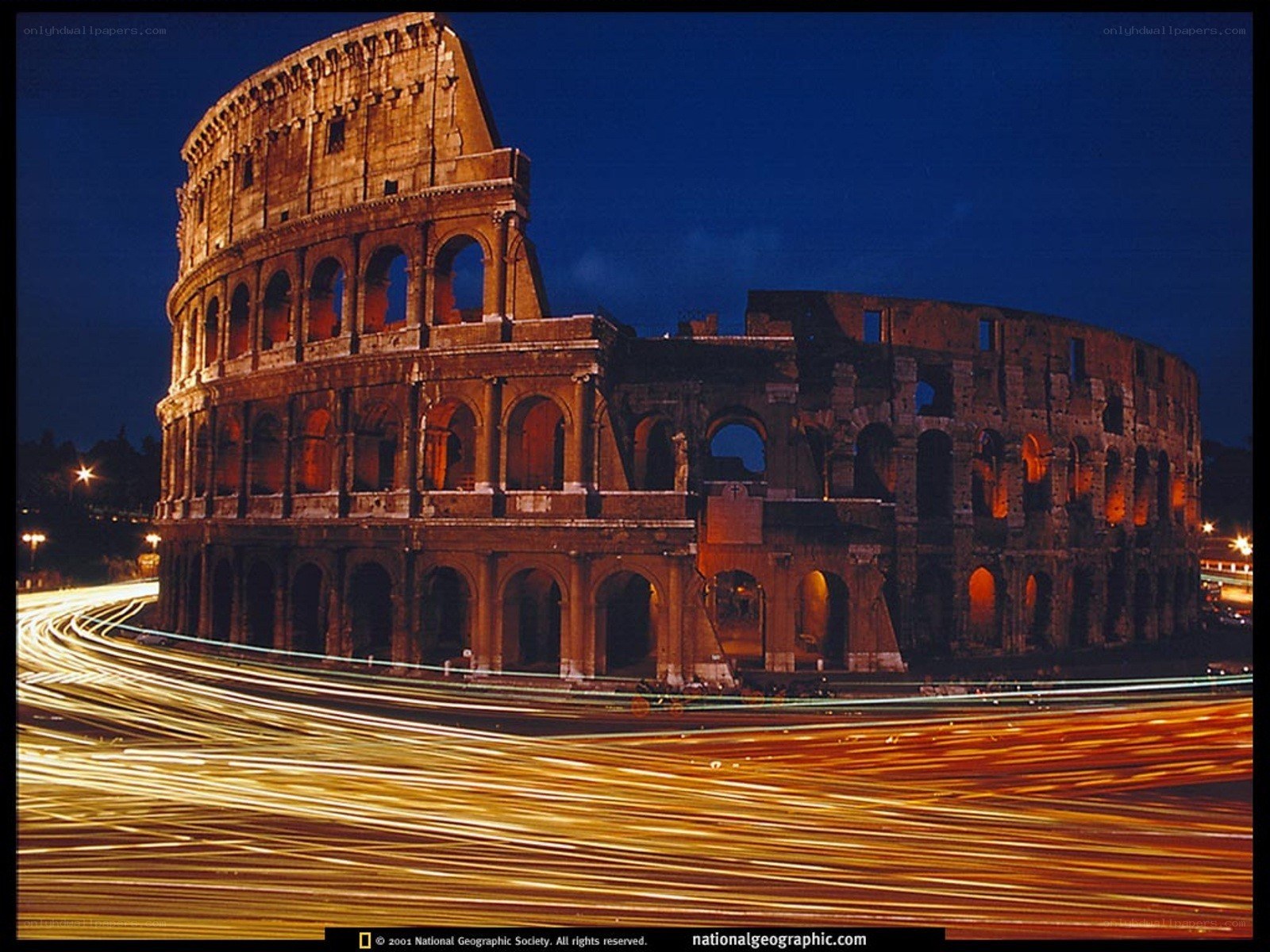 Colosseum at night with light trails
