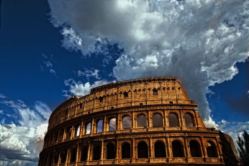 Colosseum under dramatic sky