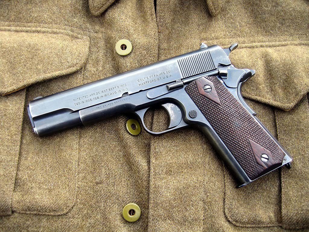 Colt 1911 pistol on wool coat