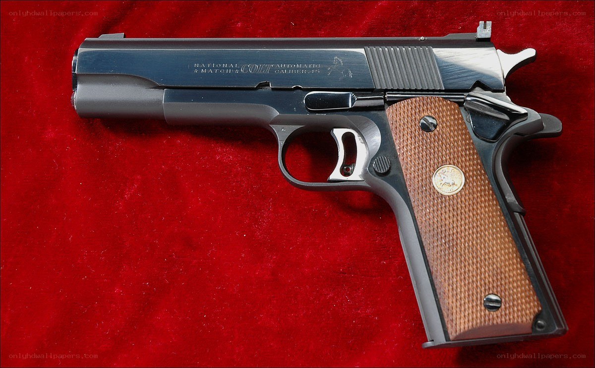 Colt .45 pistol on red cloth