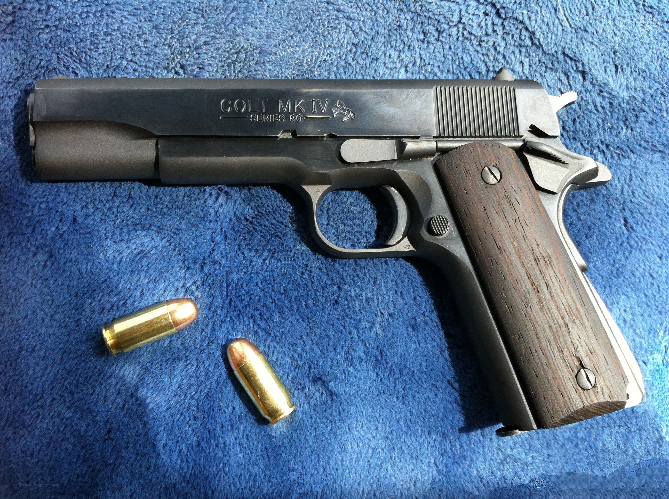 Colt MK IV pistol with bullets