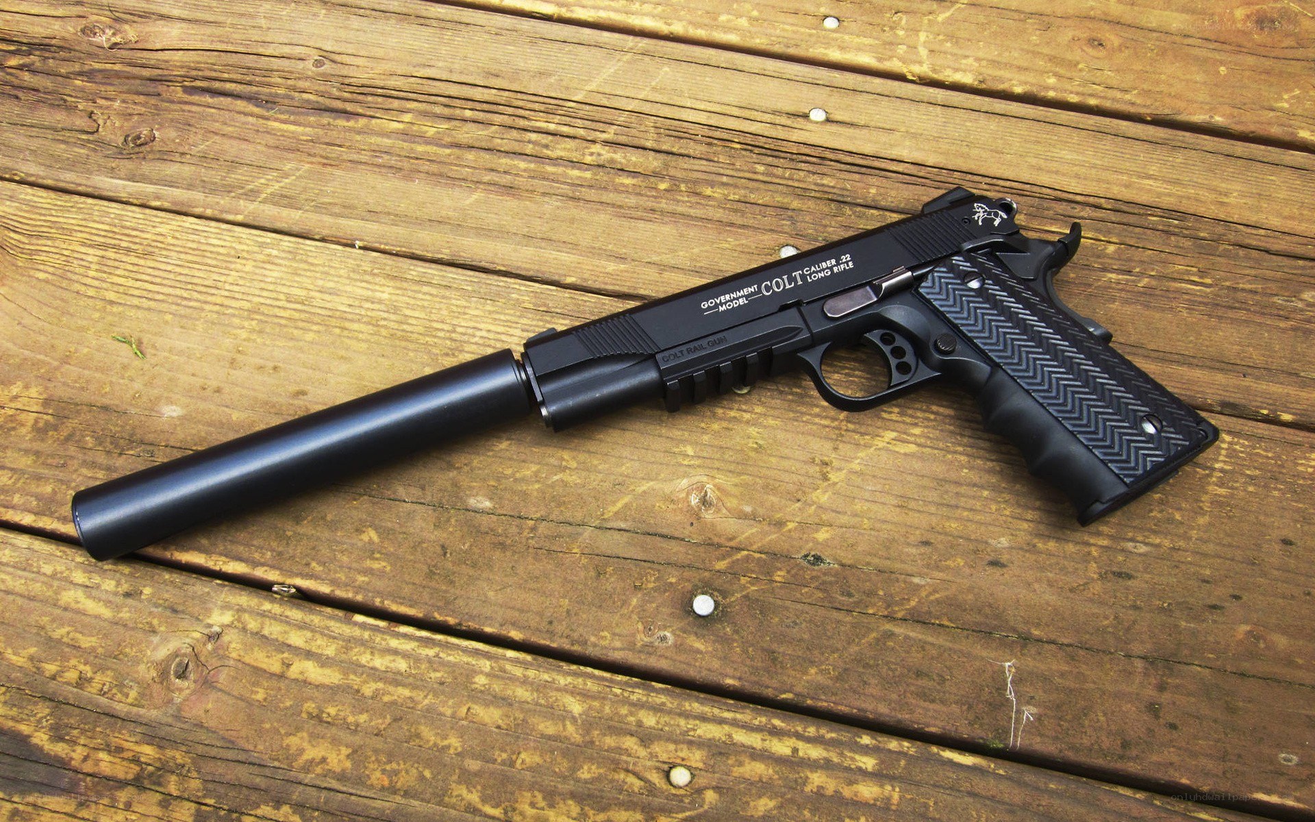 Colt pistol with suppressor