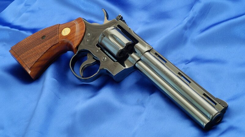 Colt revolver on blue cloth