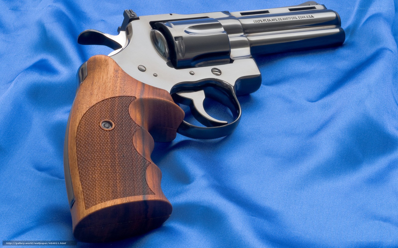 Colt revolver on blue cloth