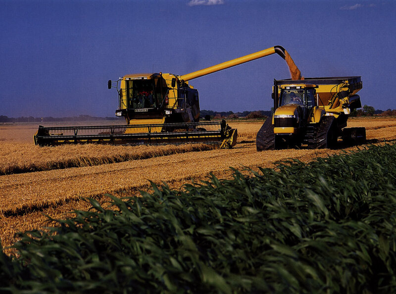 Combine Harvester in Field — Yellow
