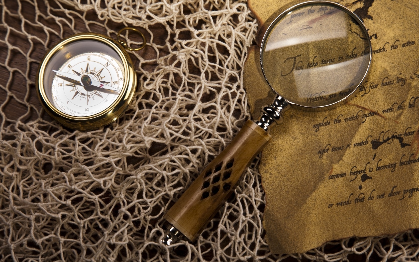 Compass and magnifying glass on map