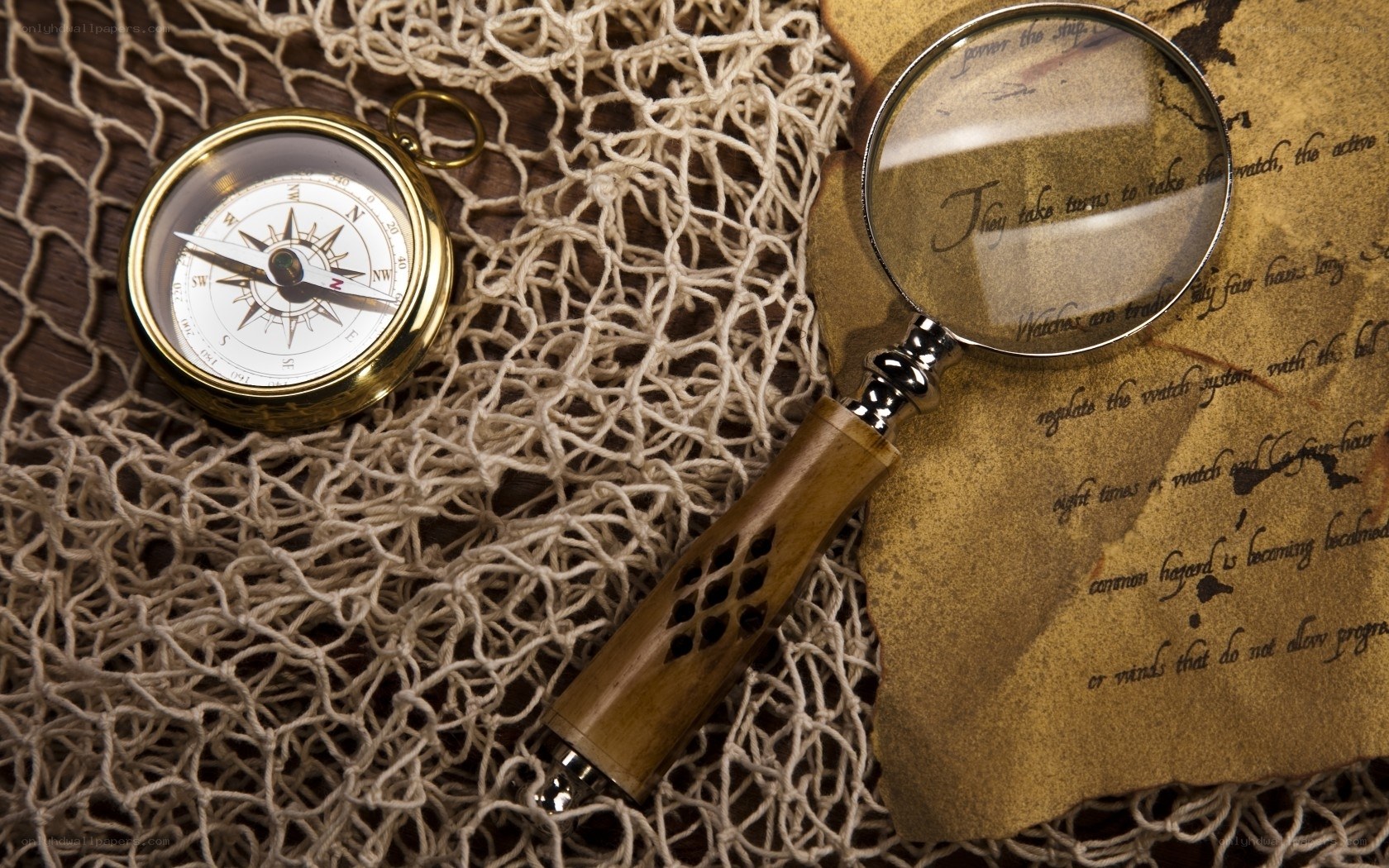 Compass and magnifying glass on map
