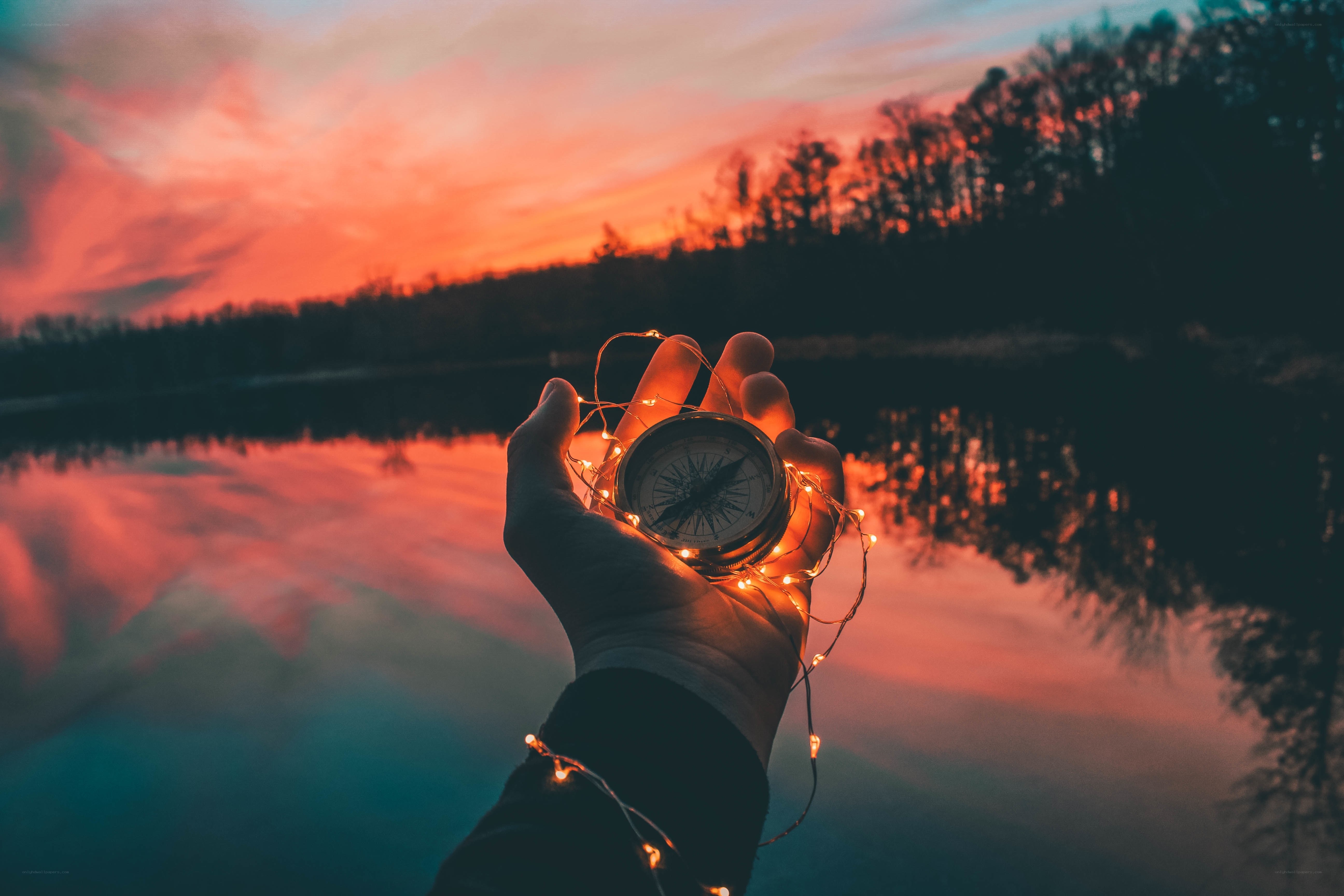Compass at sunset by the lake
