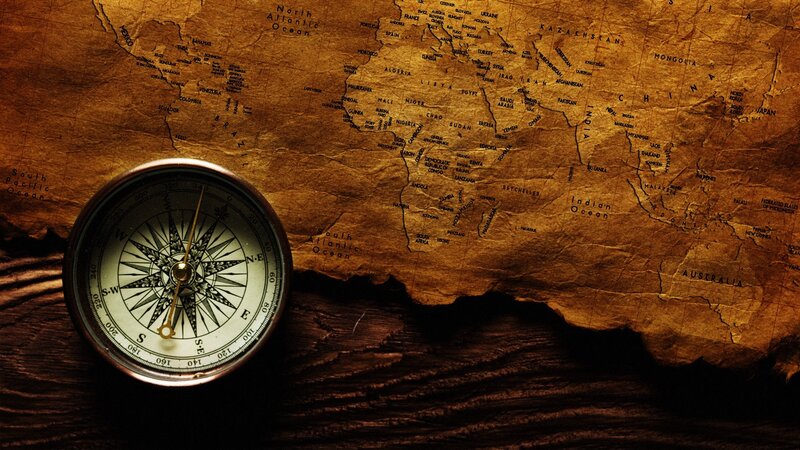 Compass on Old Map — Dramatic
