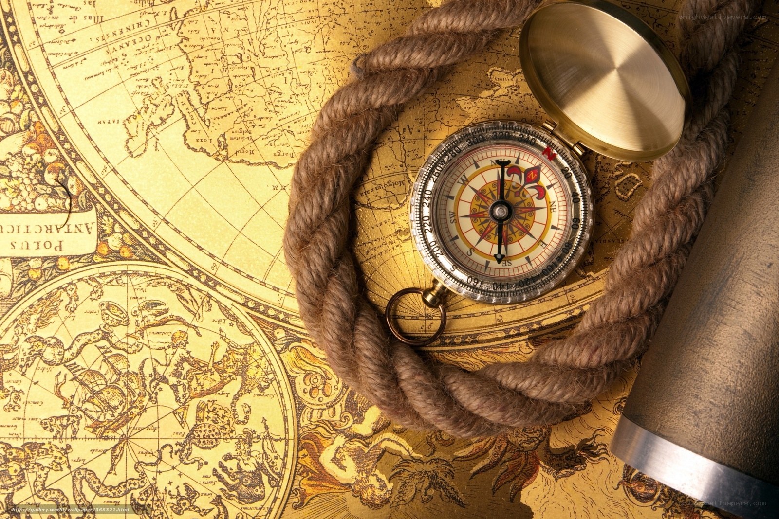 Compass on old map with rope