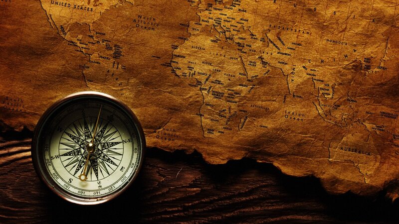 compass on old world map