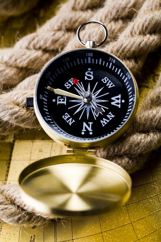 Compass on rope and map
