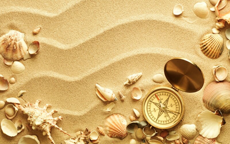Compass on Sandy Beach — Beige