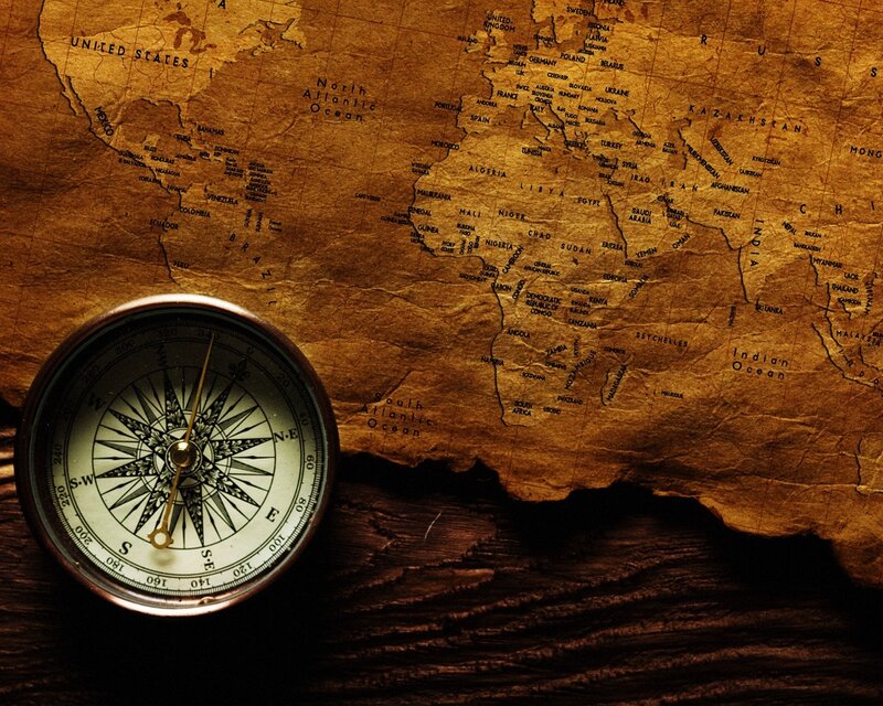 compass on vintage world map
