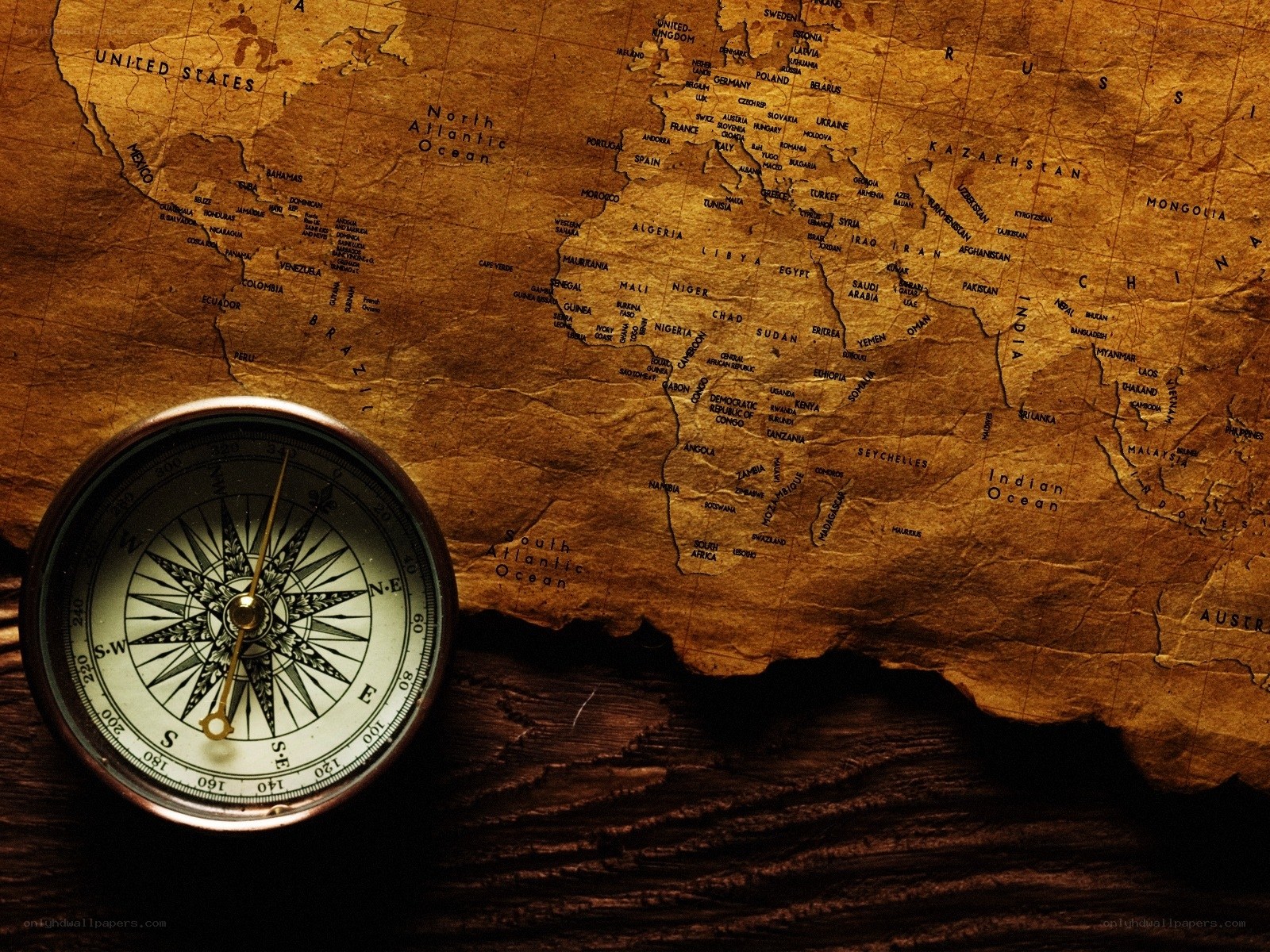 compass on vintage world map