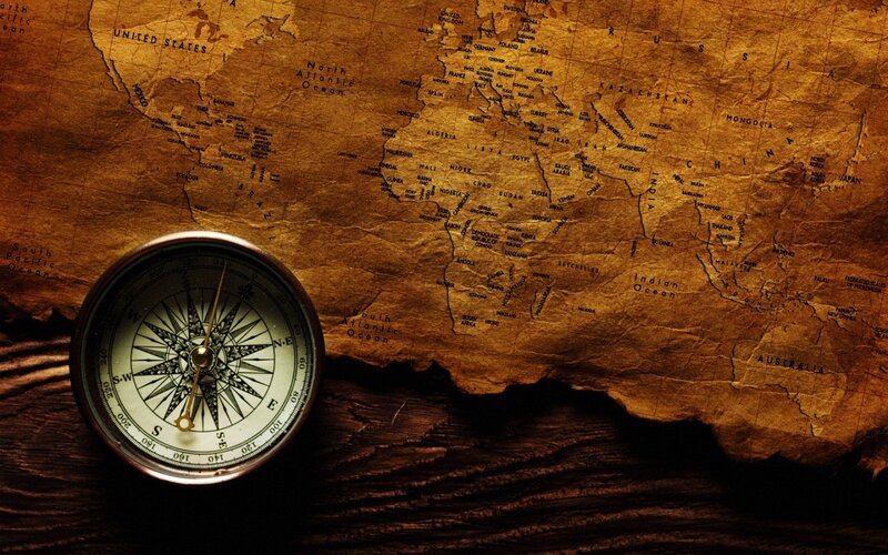 Compass on World Map — Brown, Dramatic, Photograph
