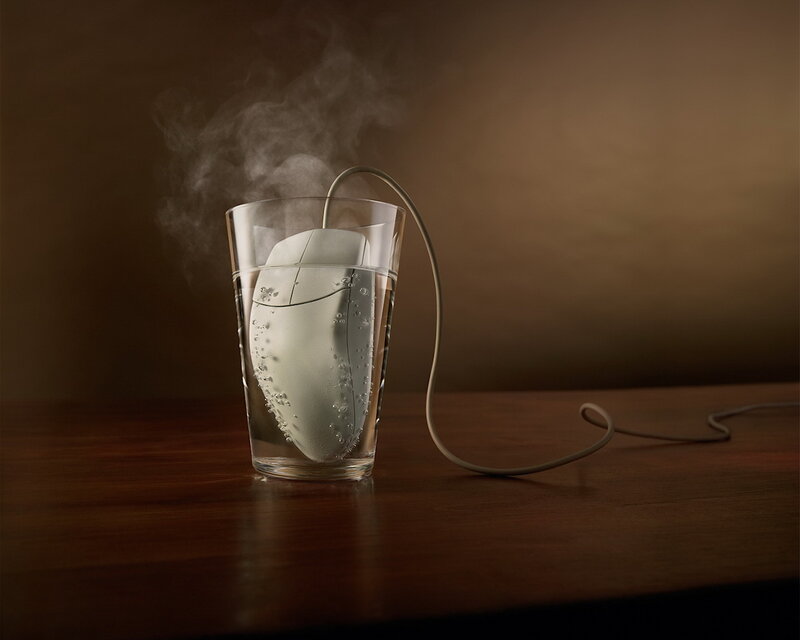 Computer mouse in steaming water