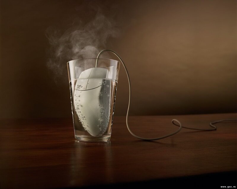 Computer mouse in steaming water