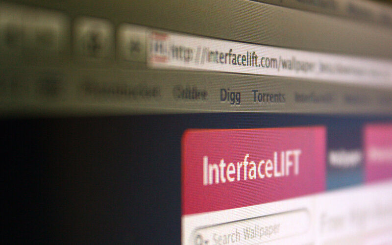 Computer Screen Displaying Website — Red, Neutral
