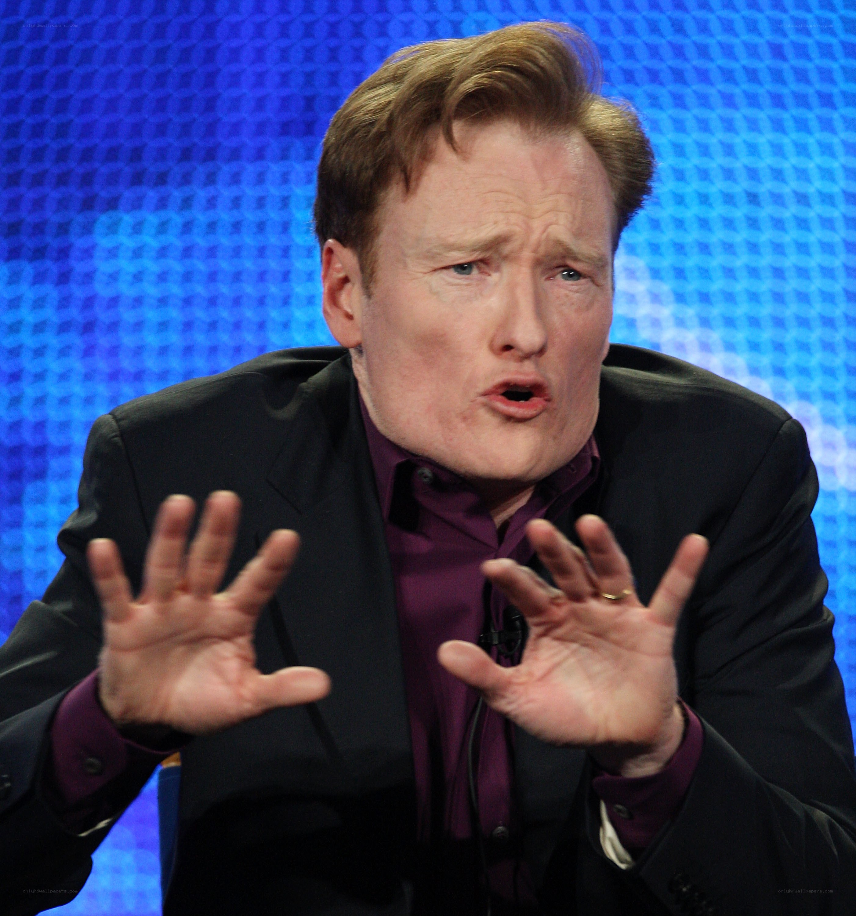 Conan O'Brien speaking on stage