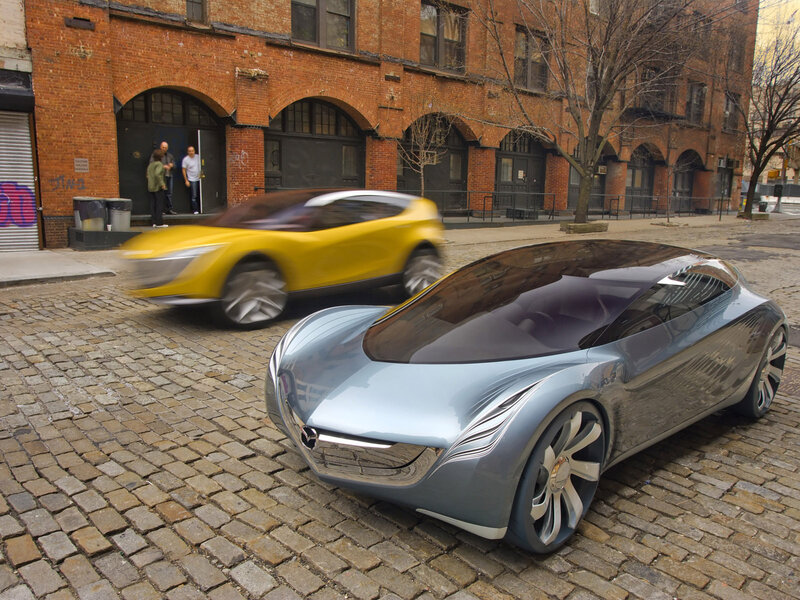 Concept cars on cobblestone street