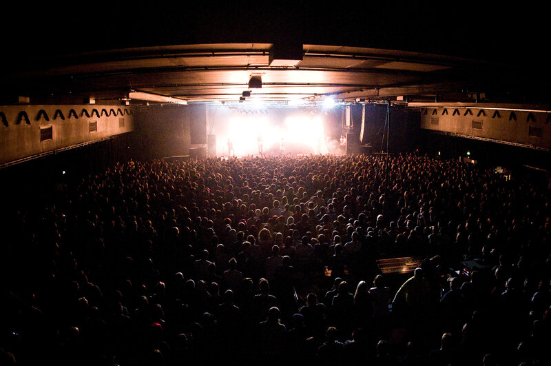 Concert crowd in dark venue