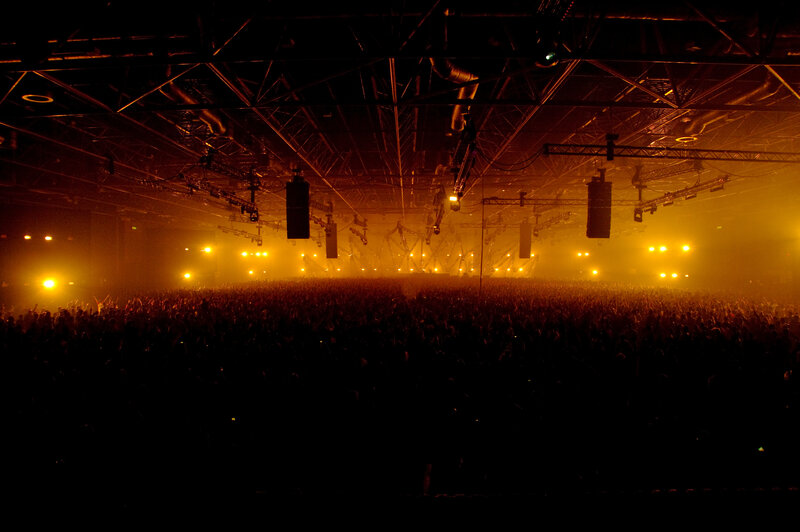 Concert crowd in golden light