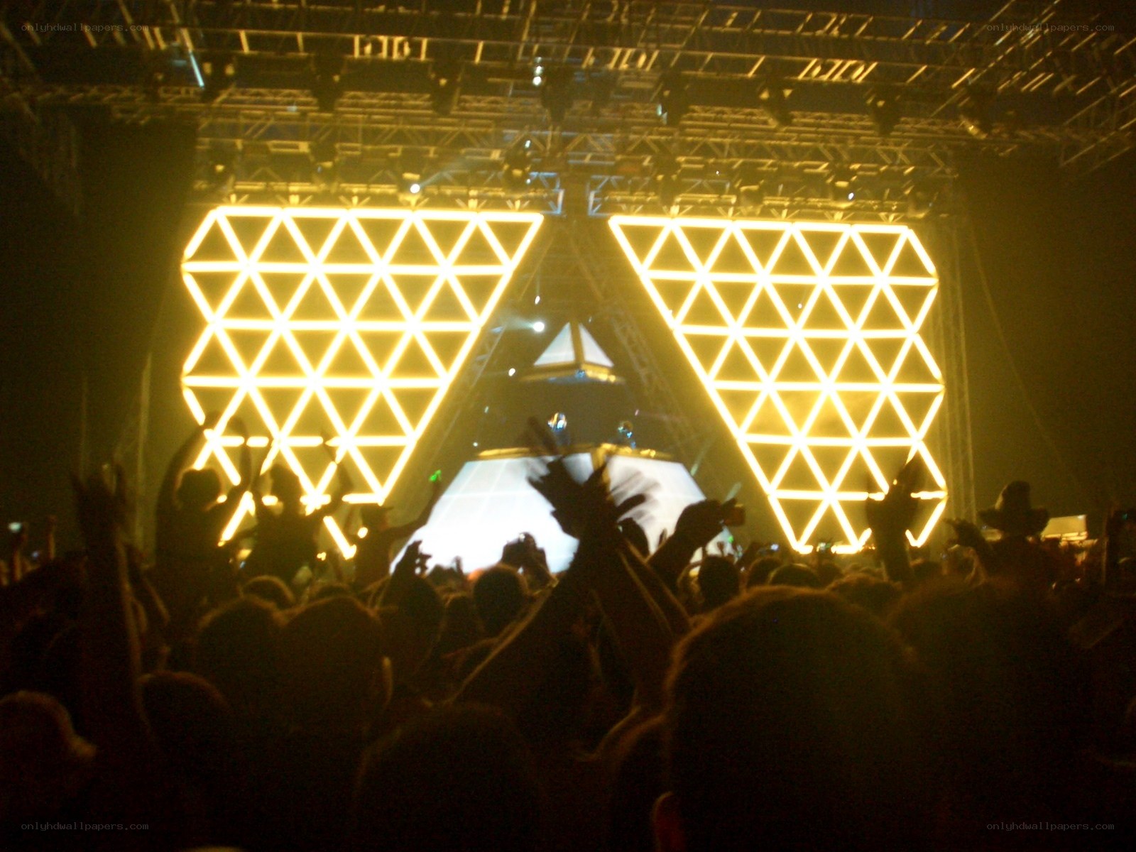 Concert crowd with glowing triangles