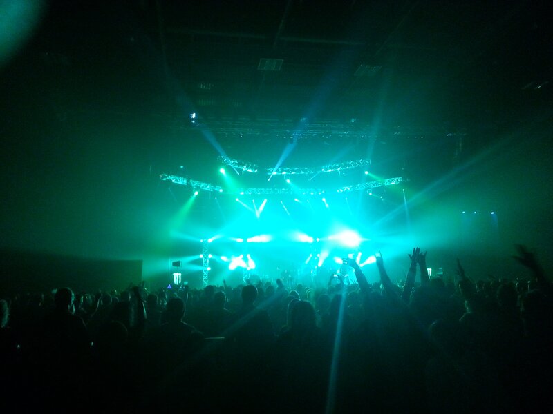 Concert crowd with green lights