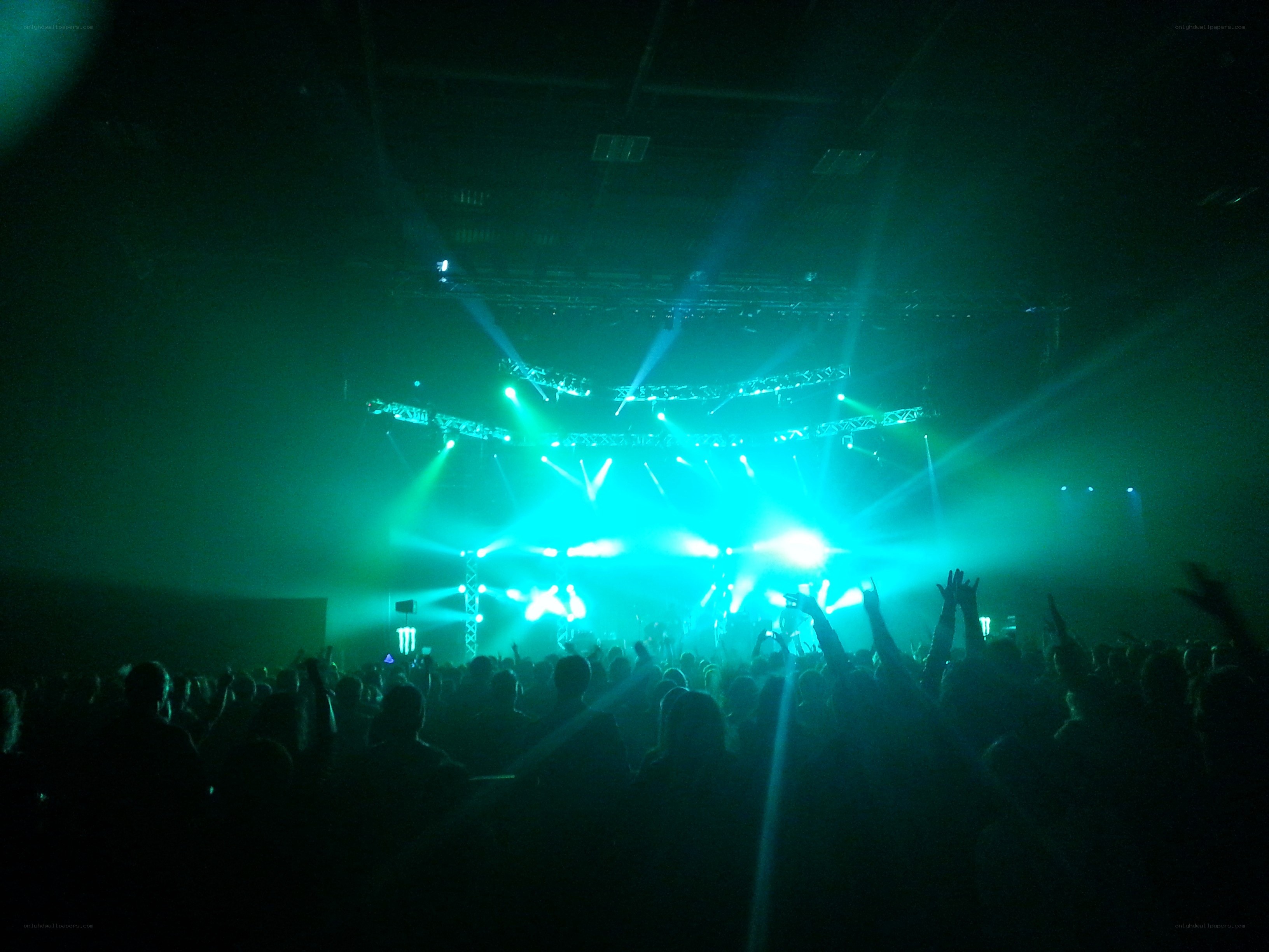 Concert crowd with green lights