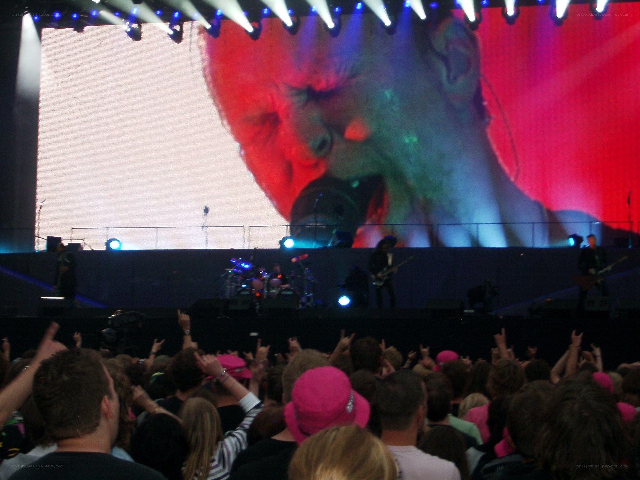 concert crowd with large screen