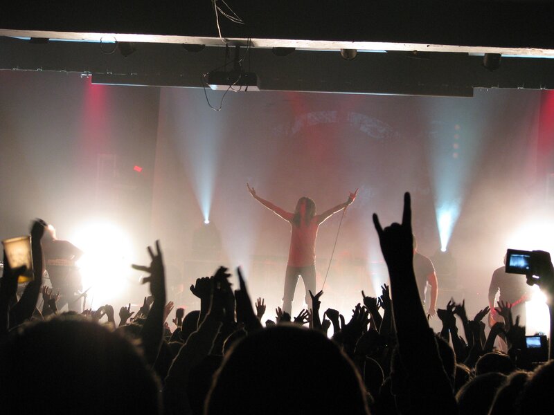Concert crowd with raised hands