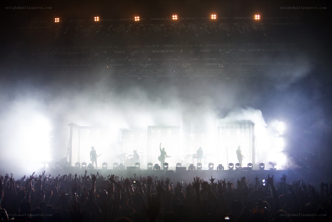 Concert crowd with raised hands