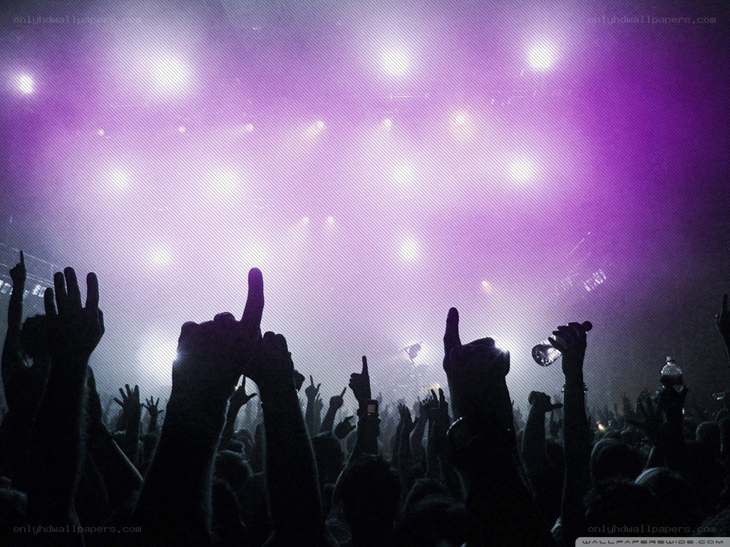 Concert crowd with raised hands