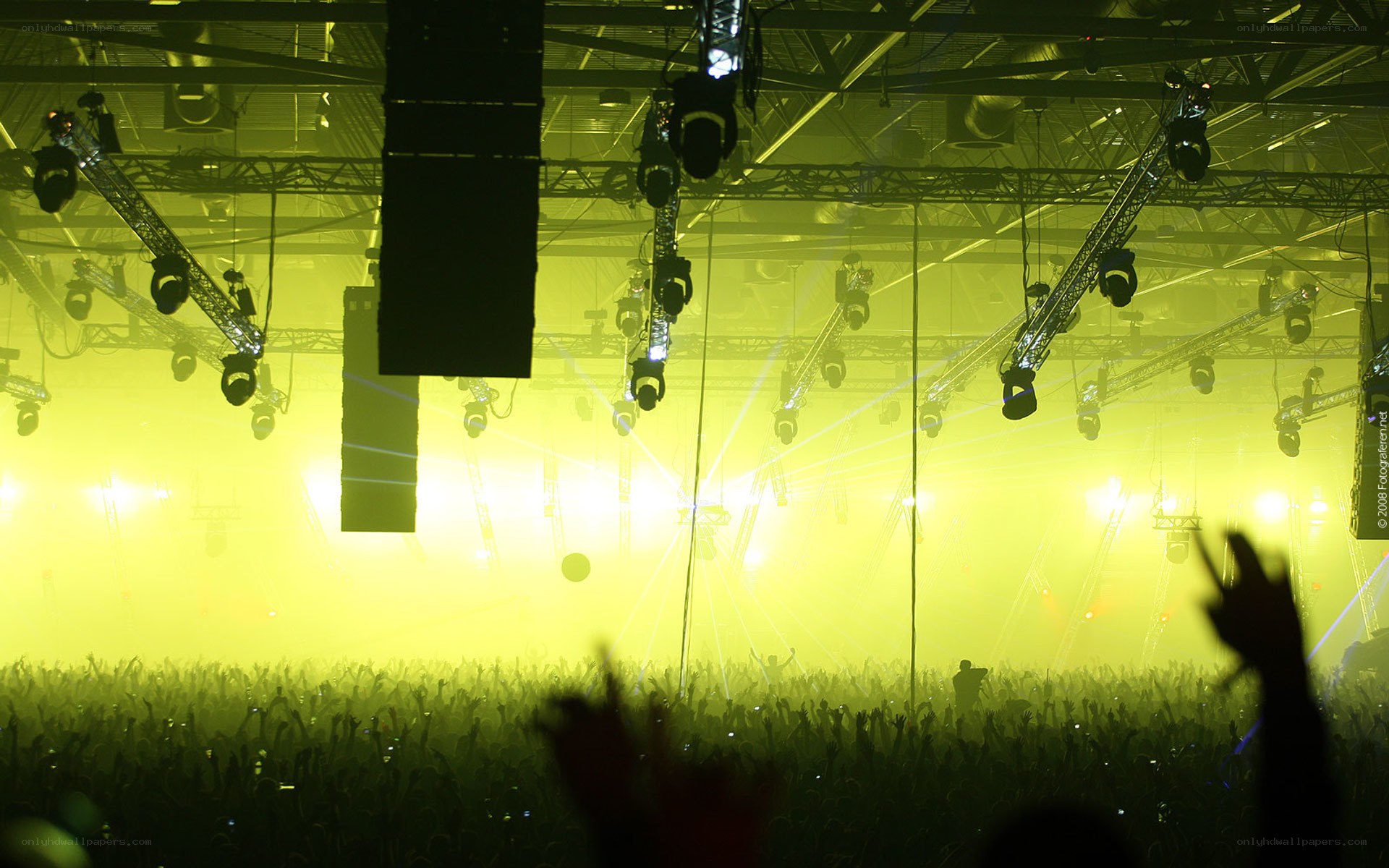 Concert crowd with yellow lights