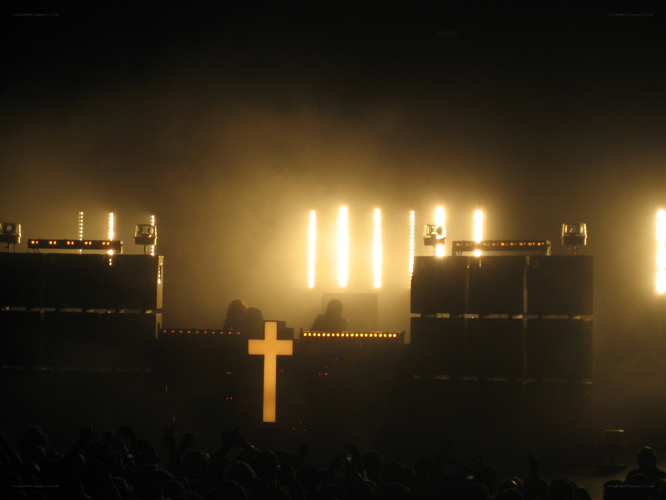 concert with glowing cross